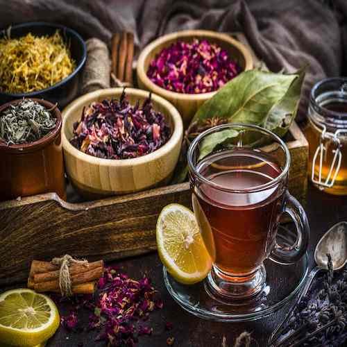 tea cup with several dried tea leaves and flowers 1201496311 55f0a4dfdbc54605966a0a9ec2f40f3c